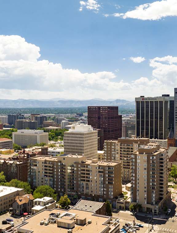 arial view of a city with tall buildings and a pool