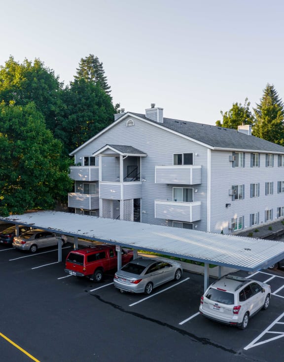 a picnic table with a grill in a yard  at Ironwood Apartments, Coeur d'Alene, 83814
