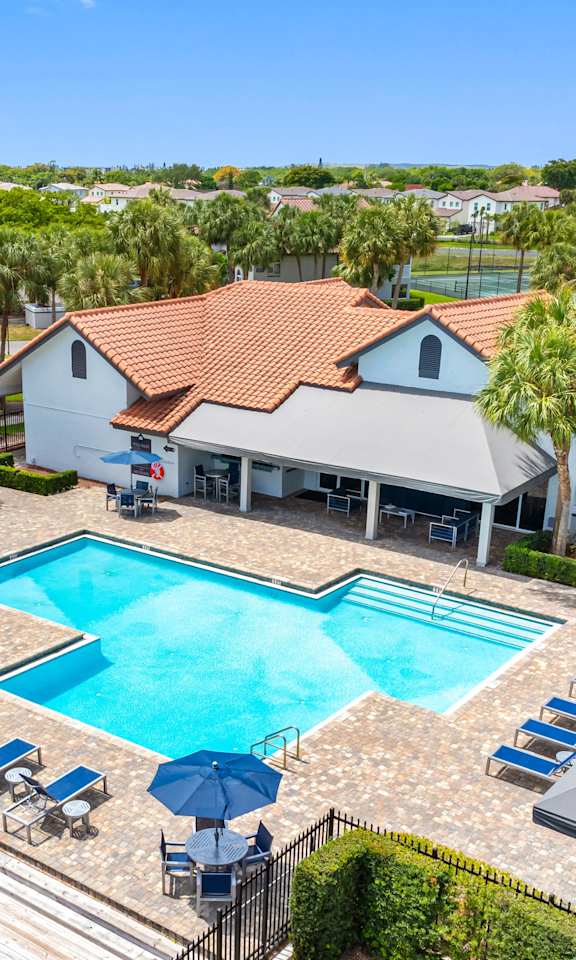 A large house with a pool in the backyard.
