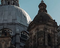 The image features two domed structures with intricate architectural details.