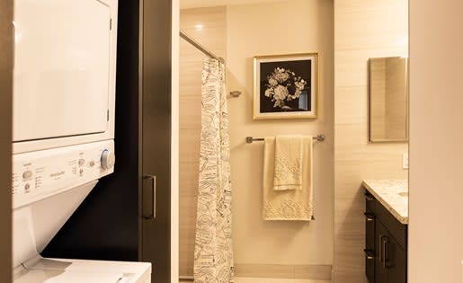a bathroom with a sink a toilet and a shower