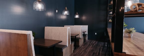 a dining room with a wooden table and stools