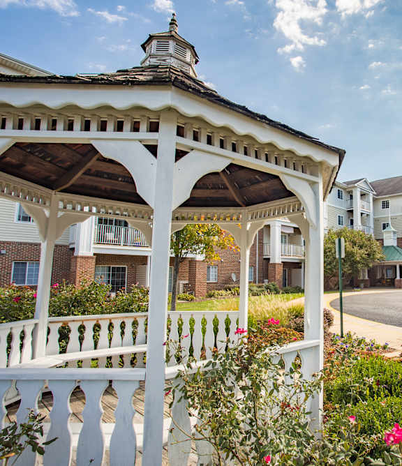 a gazebo with a building in the background