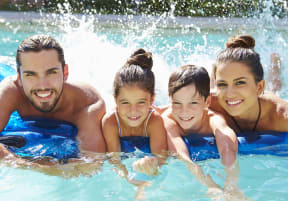 a family in a swimming pool