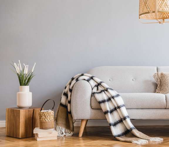 a blanket draped over a couch in a living room