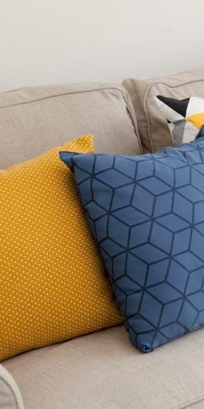 a couch with a bunch of pillows on it