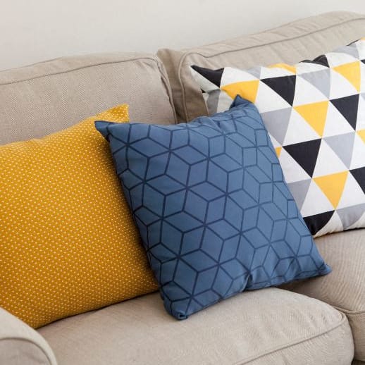 a couch with a bunch of pillows on it