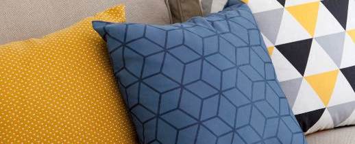 a couch with a bunch of pillows on it
