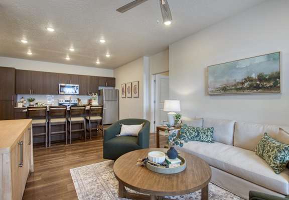 A living room with a couch, chair, and coffee table.