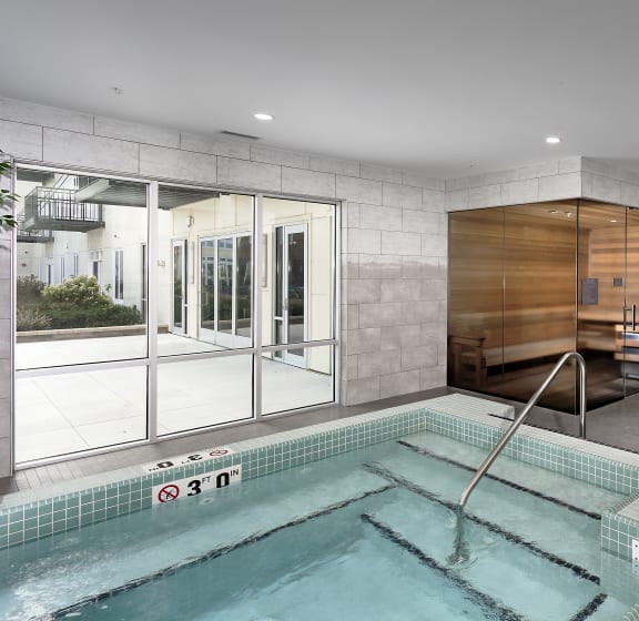 a spa with a pool and a glass door at The Residences of Wilmette, Wilmette, Illinois