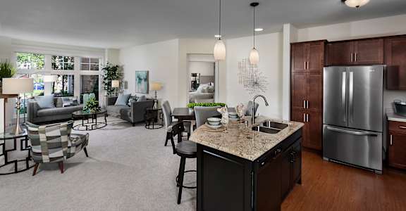 an open floor plan with a kitchen and living room