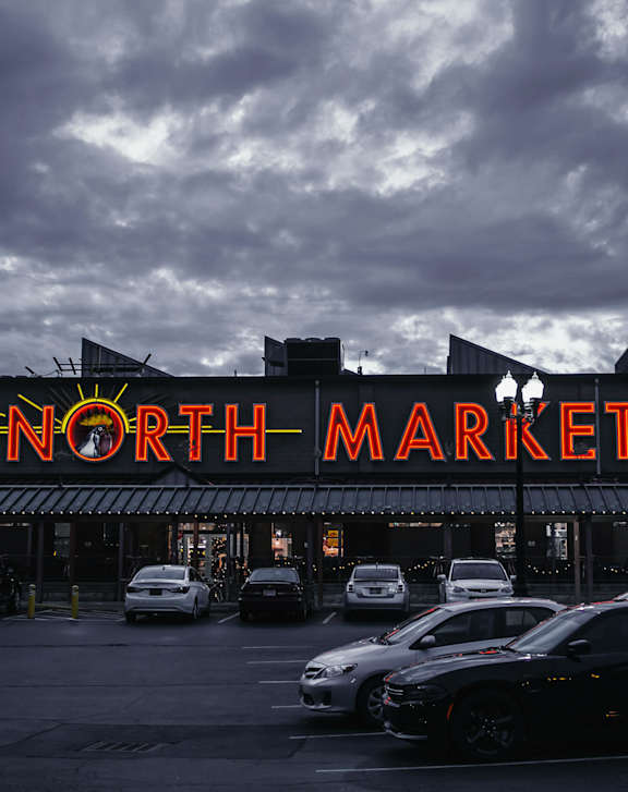 A parking lot in front of a North Market building at River View at Bexley Apartments, Columbus, OH 43209