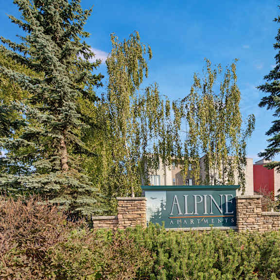 A sign at the entrance to the alpine village apartments.