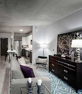 a living room and kitchen in a studio apartment at Residences at Addison Clark Apartments, IL, 60613