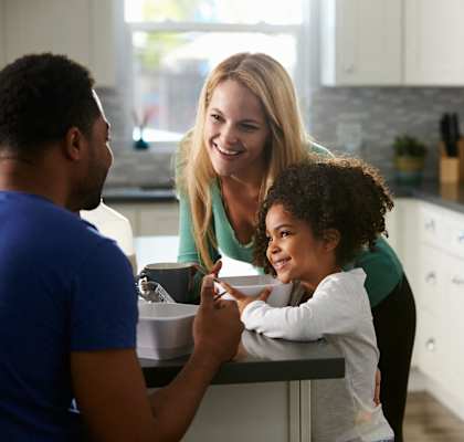 a family in a kitchen talking to each other at Villa Serena, Henderson, NV, 89014