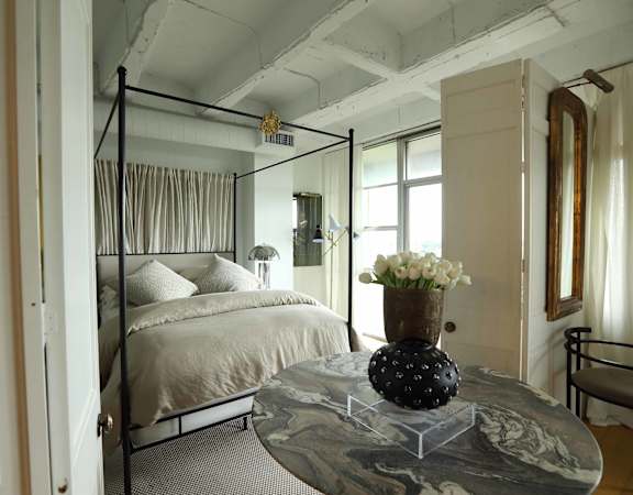 Bedroom with large windows and natural lighting
