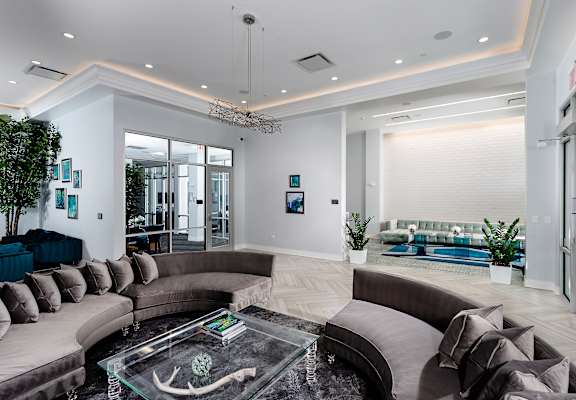 a lobby with couches and a glass coffee table at The Residences of Wilmette, Wilmette, Illinois