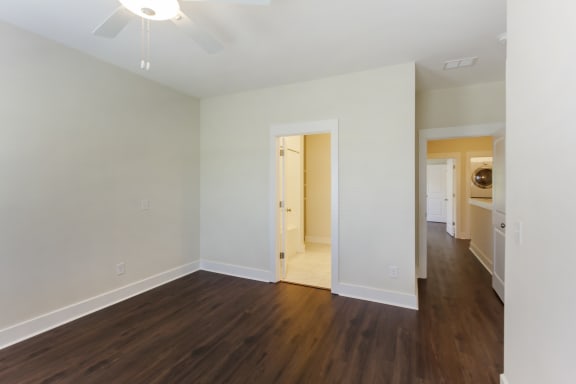 A room with a wooden floor and a ceiling fan at Waverly Place, North Charleston, SC, 29418