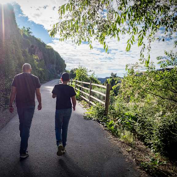 Two people walking down a path.