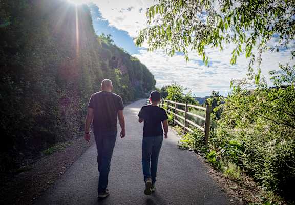Two people walking down a path.
