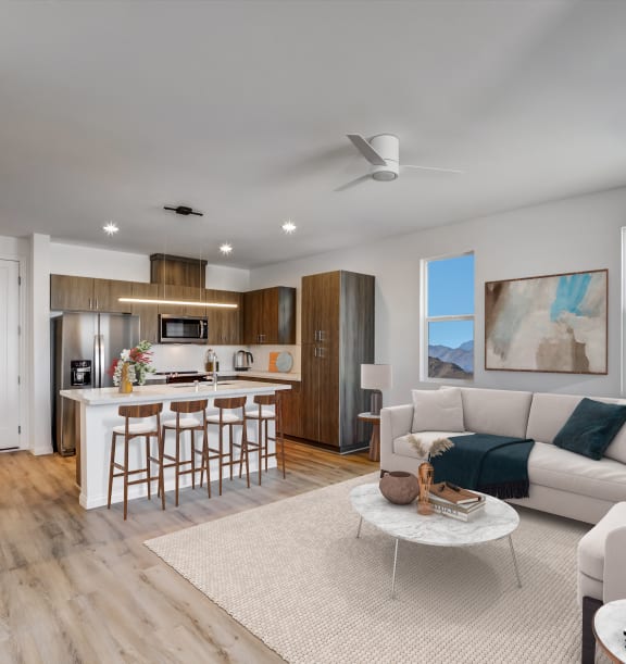 a living room with a kitchen and a couch and a table