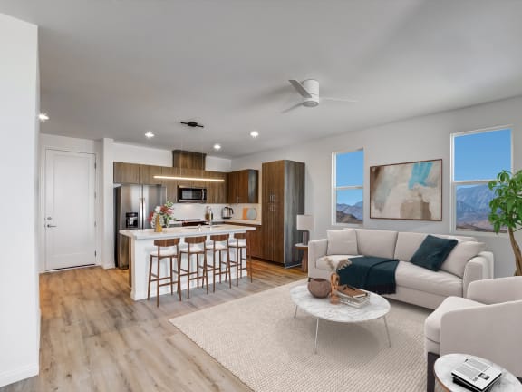 a living room with a kitchen and a couch and a table