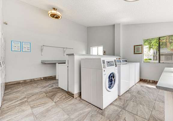 A laundry room with a washer and dryer.