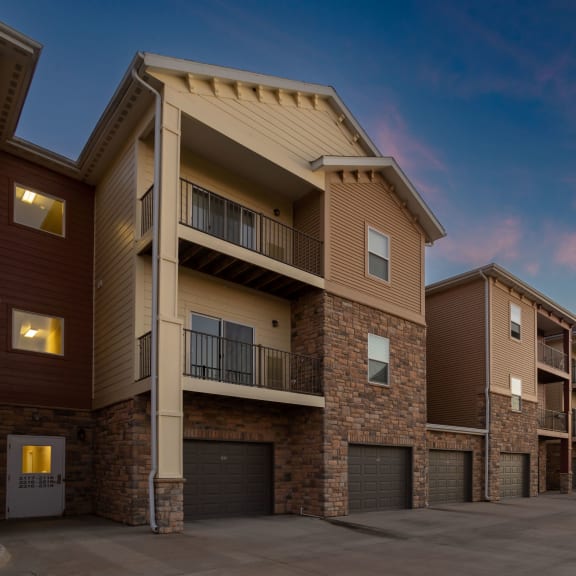 a row of town houses with balconies and garages