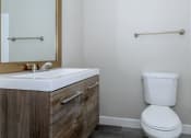 Thumbnail 12 of 22 - an empty bathroom with a toilet and a sink