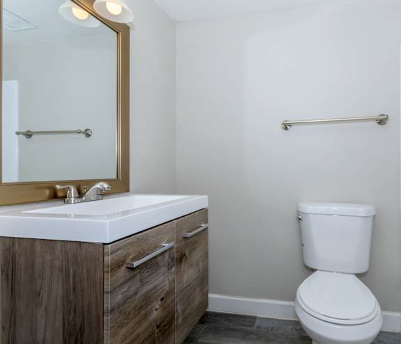 an empty bathroom with a toilet and a sink