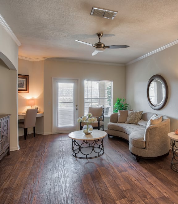 a living room filled with furniture and a ceiling fan  at Ballantrae Apartments, Sanford, FL, 32771