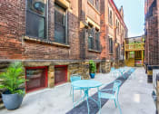 Thumbnail 17 of 20 - Beautiful Common Courtyard with Tables and Chairs at San Sofia Luxury Apartments, Cleveland, Ohio, 44113