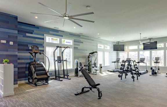 the gym at the enclave at woodbridge apartments in sugar land, tx