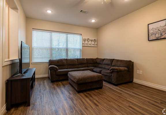 a living room with a couch and a tv