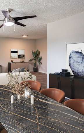 A living room with a white couch and a television.