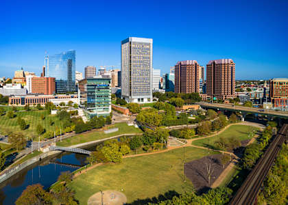 an aerial view of a park and the city skyline
