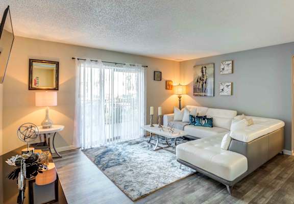 a living room with a couch and a table