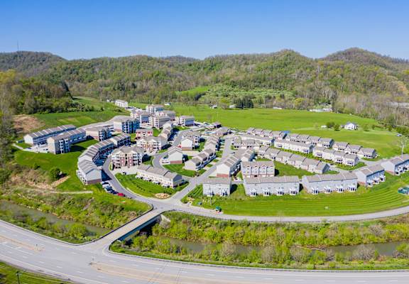 a aerial view of a community with houses and a road