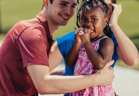 a man and a young girl holding a little girl at Villa Serena, Henderson, NV, 89014