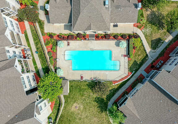 A swimming pool surrounded by a red brick border.
