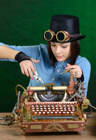 woman typing on a typewriter at Altis Grand Central Apartments in Tampa, FL