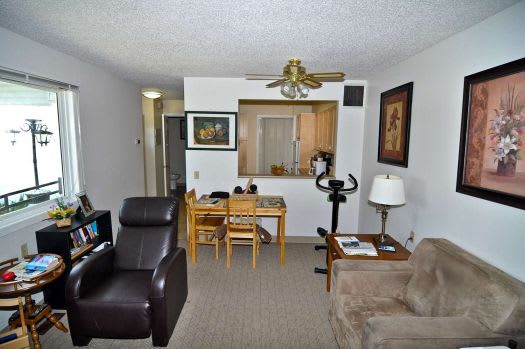 a living room with a couch a chair and a table