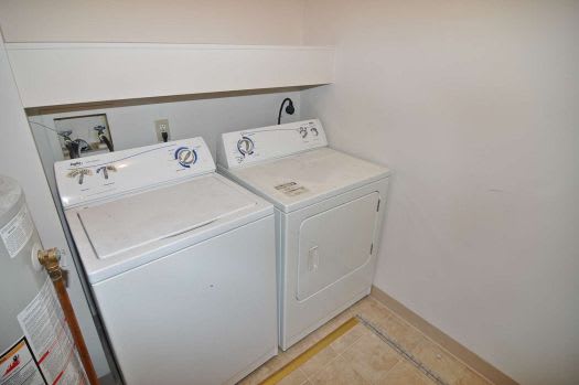 a white washer and dryer in a room
