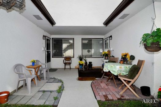 a living room with a table and chairs in it