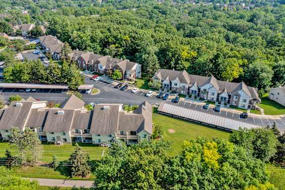 A bird's eye view of a residential area with houses and trees.