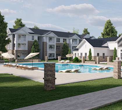 A large, modern residential complex with a swimming pool.