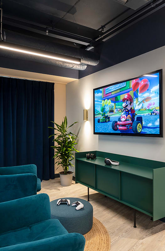 a living room with green walls and orange carpet