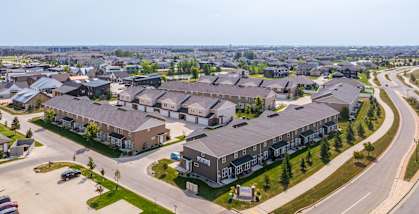 A large residential complex with multiple buildings and a parking lot.