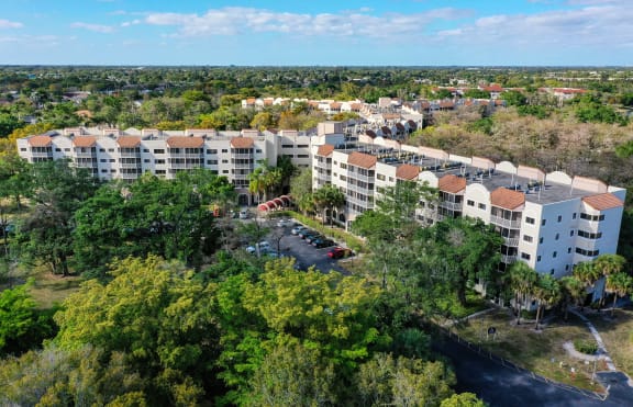 a aerial view of the resort with buildings and trees