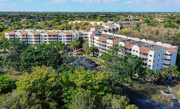 a aerial view of the resort with buildings and trees